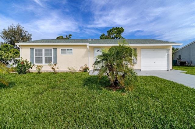 ranch-style home with cooling unit, a garage, and a front lawn