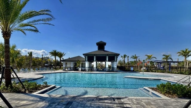 pool featuring a patio area, a gazebo, and fence