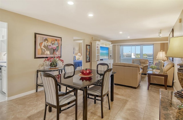 dining space with light tile patterned floors