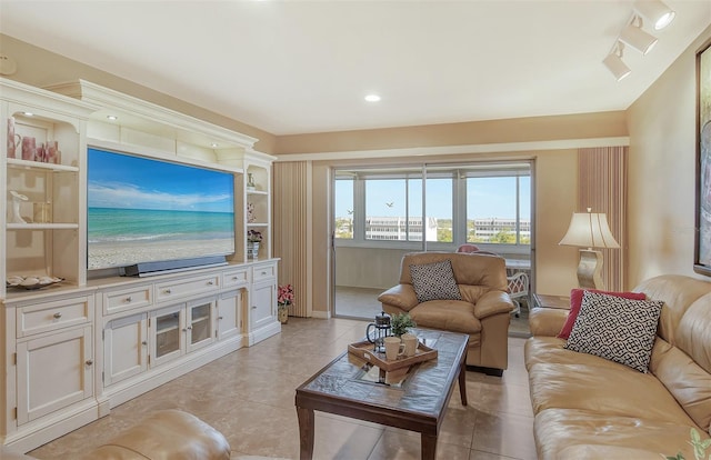 tiled living room featuring rail lighting