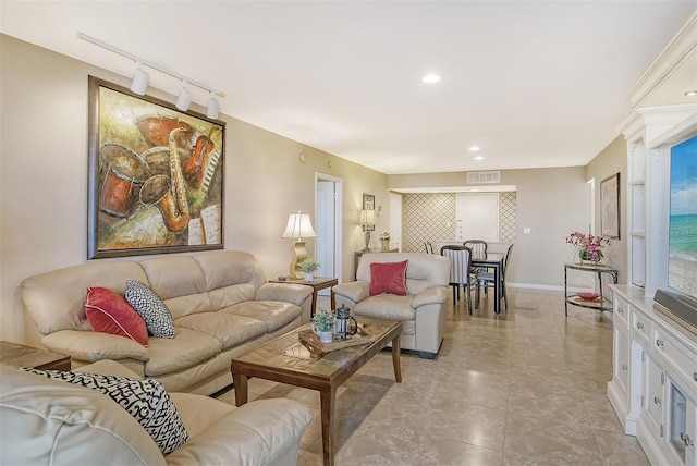 living room featuring rail lighting