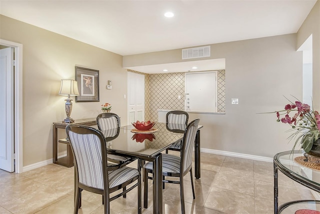 dining room with light tile patterned flooring