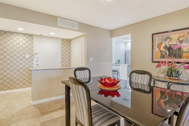 dining area with light tile patterned flooring