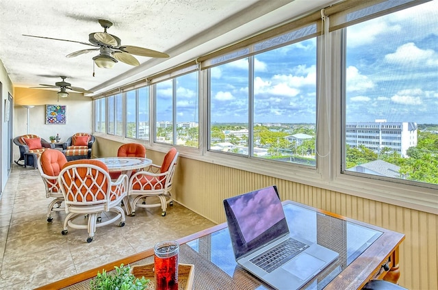 sunroom / solarium with ceiling fan