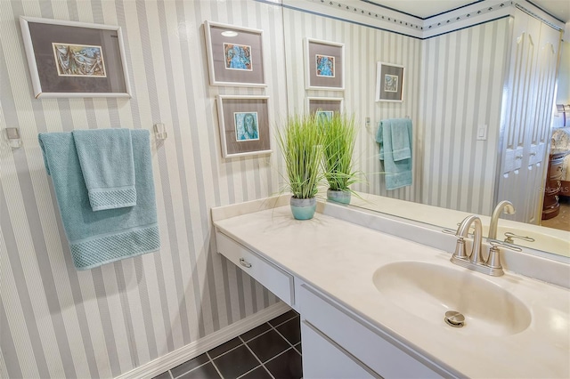 bathroom featuring tile patterned flooring and vanity