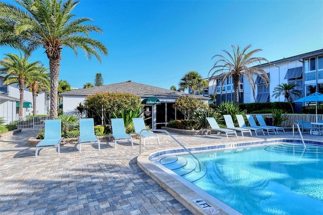 view of swimming pool with a patio area