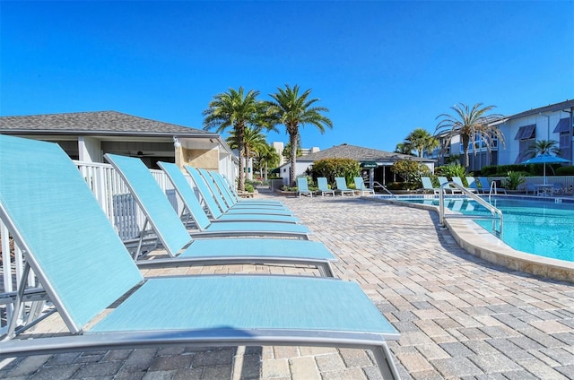 view of swimming pool featuring a patio area