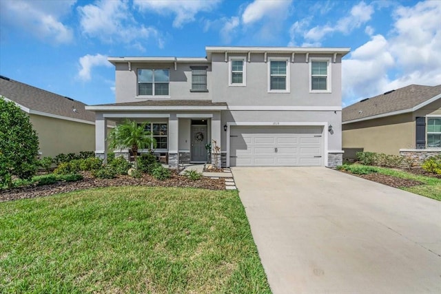 view of front of house featuring a garage and a front lawn