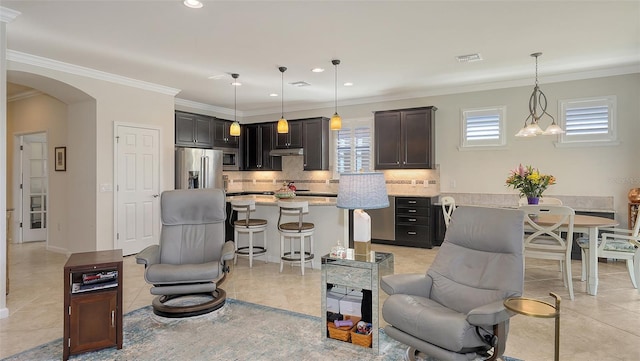 tiled living room with ornamental molding