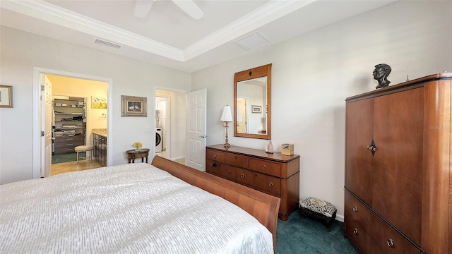 carpeted bedroom featuring a raised ceiling, ceiling fan, crown molding, and washer / dryer