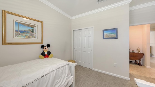 carpeted bedroom featuring crown molding and a closet