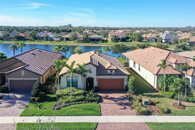 birds eye view of property featuring a water view