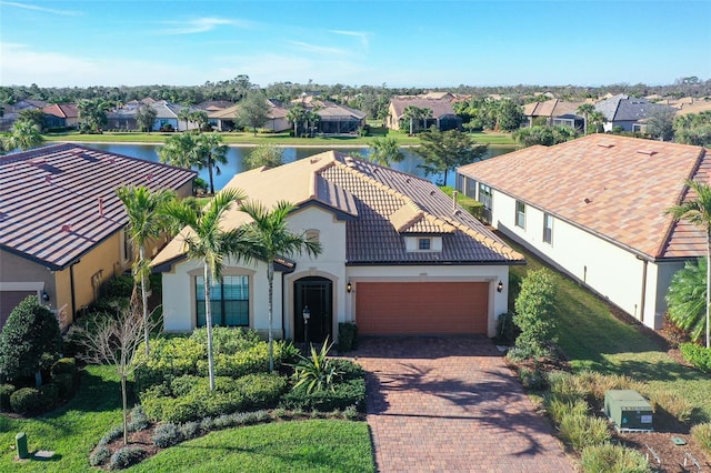 birds eye view of property with a water view