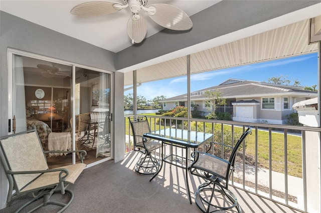 sunroom featuring ceiling fan