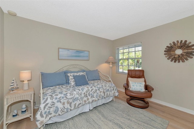 bedroom featuring hardwood / wood-style floors