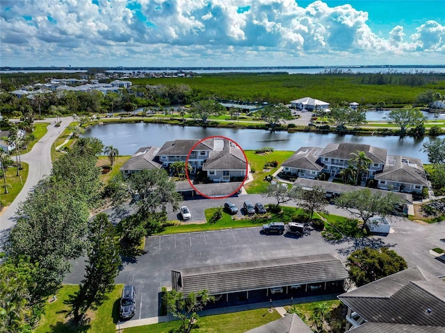 birds eye view of property featuring a water view