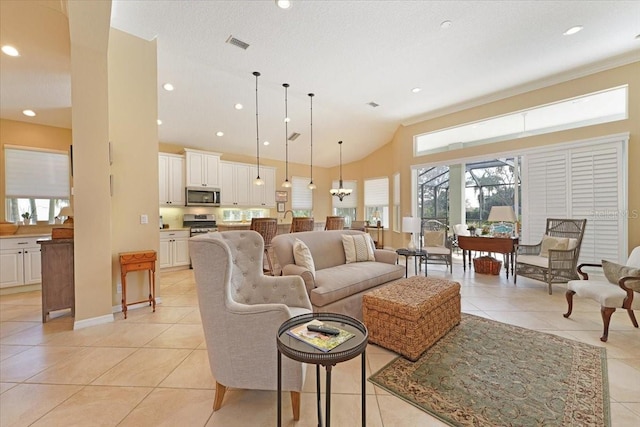 living room featuring light tile patterned floors, visible vents, high vaulted ceiling, and recessed lighting