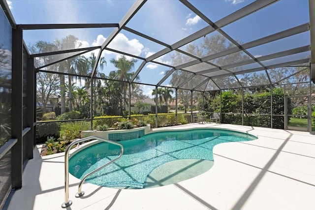 outdoor pool with a patio area and a lanai