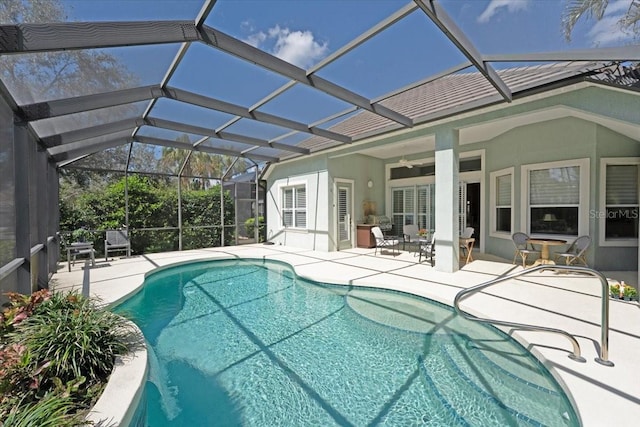 pool featuring ceiling fan, a patio, and a lanai