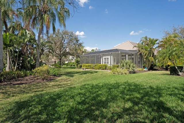 view of yard with a lanai