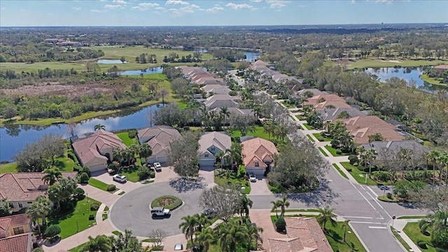 bird's eye view featuring a water view and a residential view