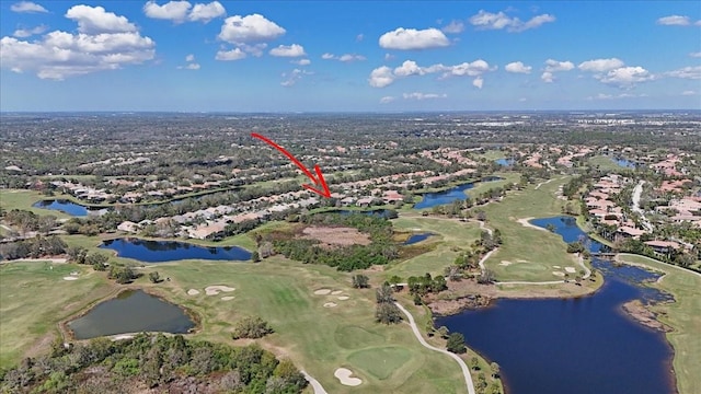 bird's eye view featuring golf course view and a water view