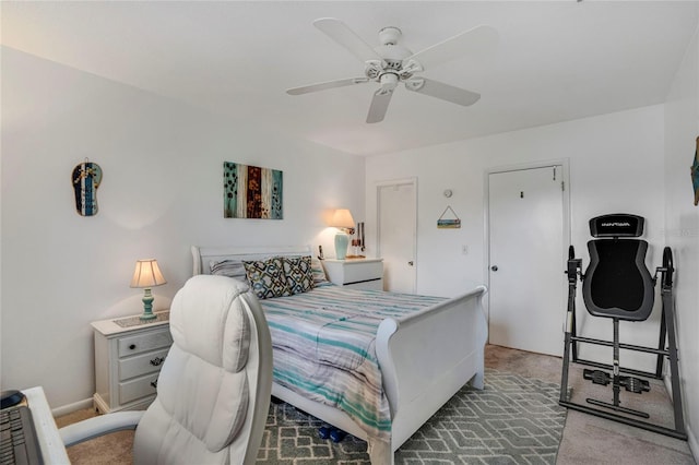 bedroom featuring light carpet, ceiling fan, and baseboards