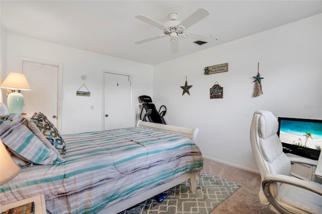 bedroom featuring light carpet, ceiling fan, visible vents, and baseboards