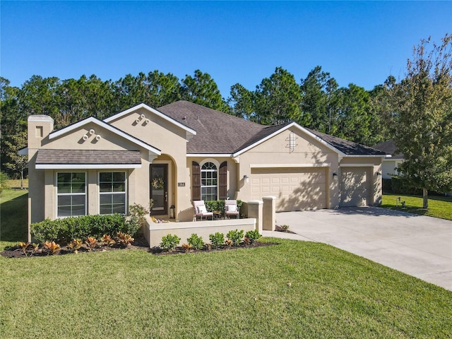 ranch-style house featuring a garage and a front yard