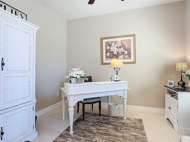 tiled home office featuring ceiling fan