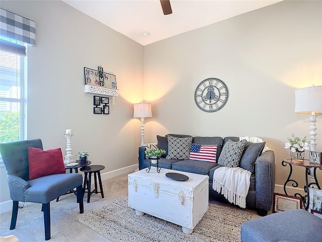 living room featuring ceiling fan and light carpet