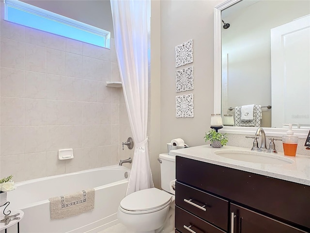 full bathroom featuring shower / bath combo, vanity, and toilet