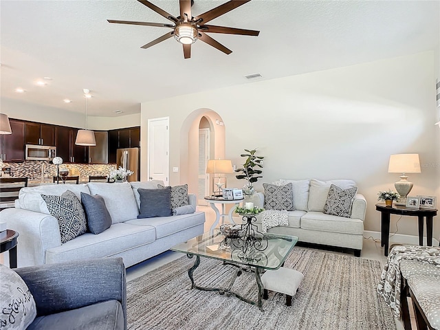 living room with ceiling fan