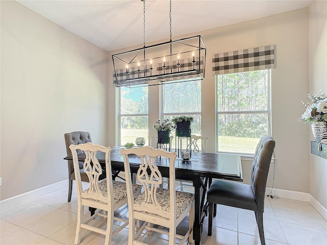 dining space featuring light tile patterned floors