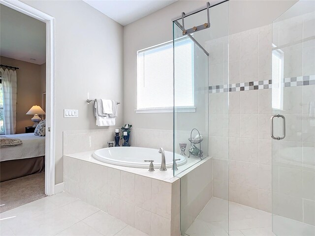 bathroom featuring tile patterned flooring and plus walk in shower