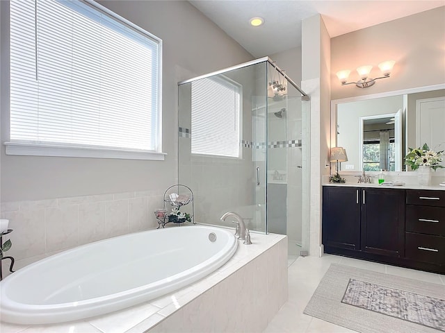 bathroom with vanity, tile patterned floors, and independent shower and bath