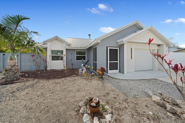 ranch-style home featuring a garage