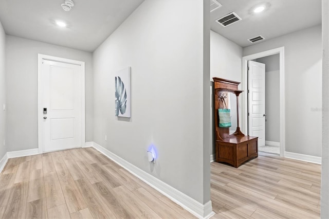 foyer with light hardwood / wood-style floors