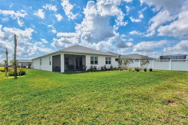 44325 Saddlewood Ct, Punta Gorda, FL 33982 - back of property featuring stucco siding and a sunroom
