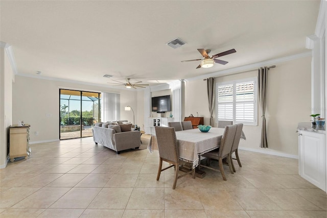 dining area featuring ornamental molding, a wealth of natural light, and visible vents