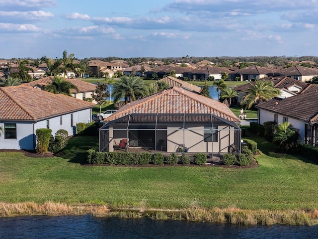 aerial view with a water view and a residential view