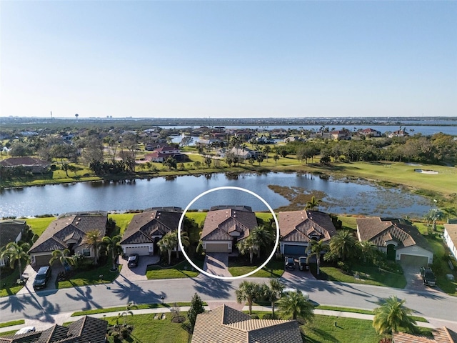 bird's eye view featuring a residential view and a water view