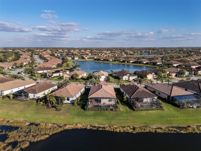 birds eye view of property featuring a residential view and a water view