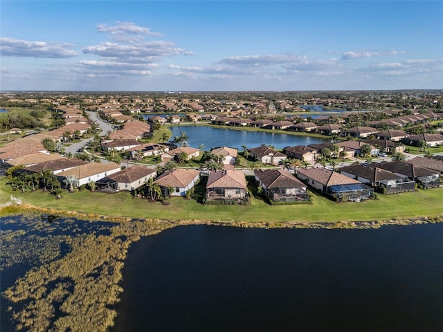 bird's eye view featuring a water view and a residential view