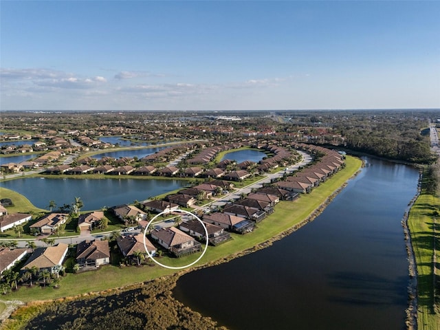 bird's eye view with a water view and a residential view