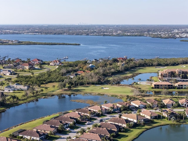 drone / aerial view featuring a residential view and a water view