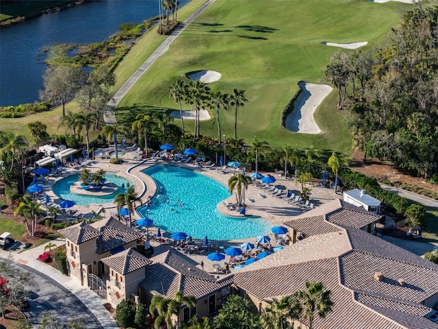 view of swimming pool with a water view and a patio area