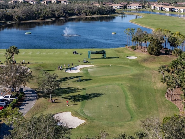 aerial view with view of golf course and a water view
