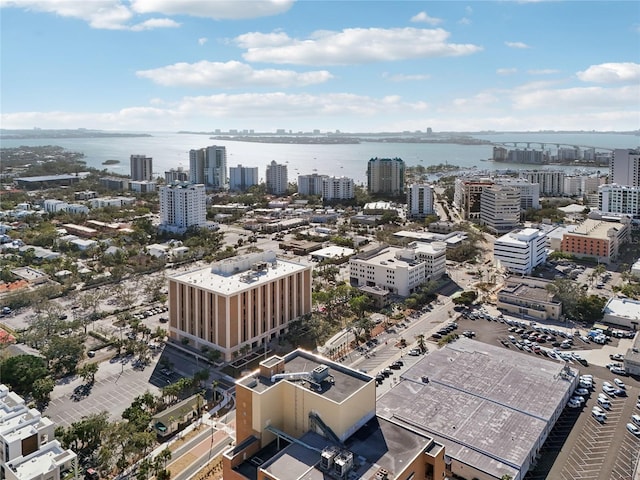 drone / aerial view featuring a water view and a city view