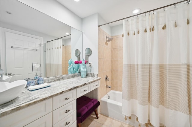 full bath with shower / tub combo, tile patterned flooring, and vanity